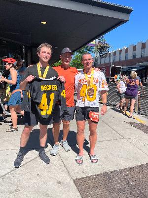 Post Missoula Marathon - running with my friend who raised money on my dads behalf for ALS Research!  We both finished in his old football jerseys